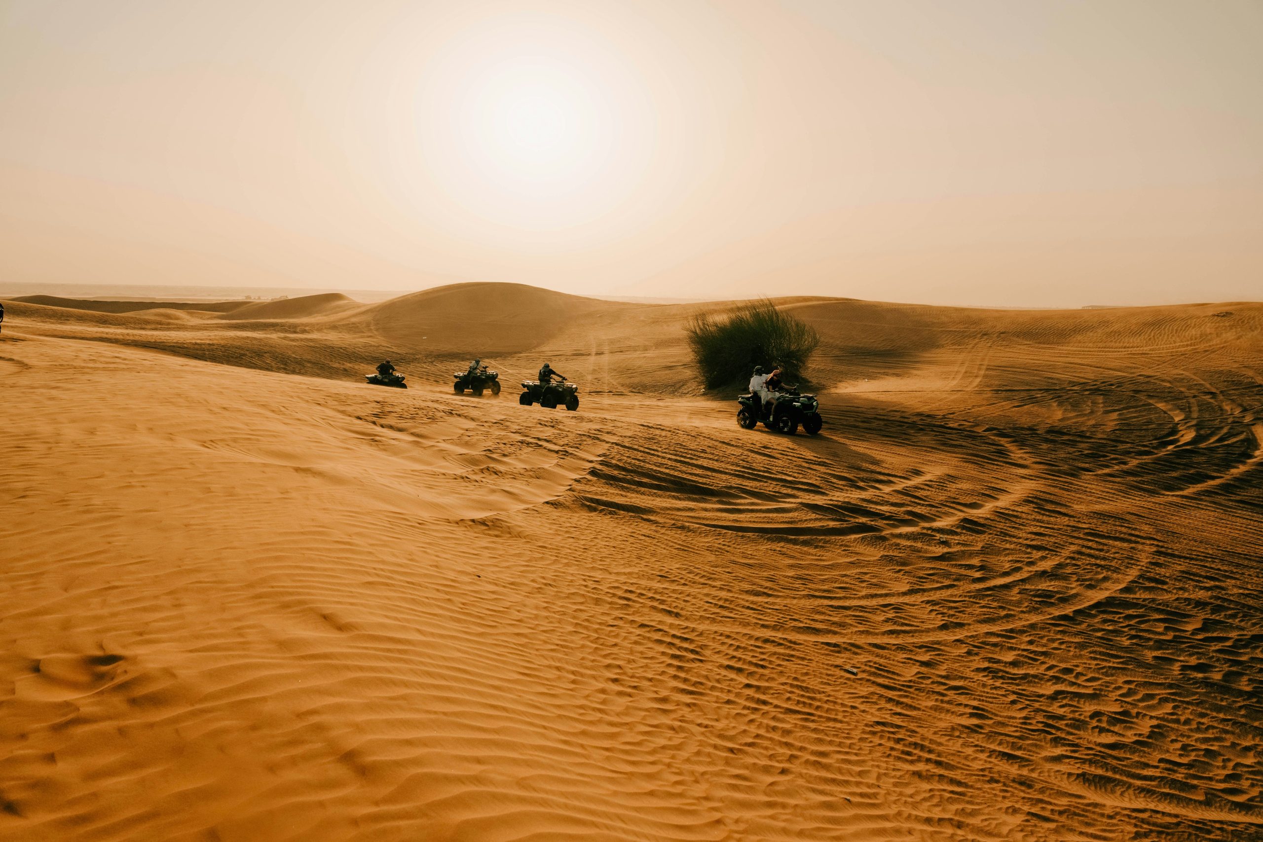 Aerial view over Dubai desert dunes at sunset